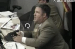 New Hope City Council Member John Elder draws his pistol at a City Council Meeting in response to hearing gunshots outside. He is also heard telling technicians to turn off the security cameras that were operating i the room at the time.